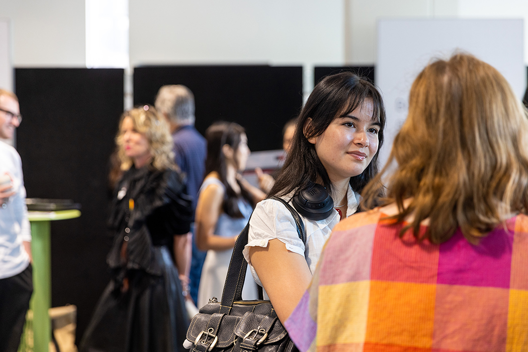 A student talking to someone at the Change of Preference Expo.