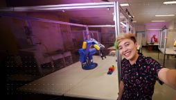 Swinburne Student standing in front of machinery