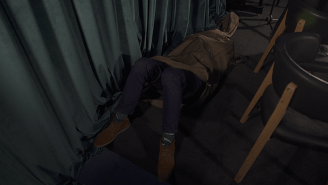 Man climbs into double bass case – closes lid – legs hanging out. 10-15 seconds. Man climbs into double bass case – closes lid – legs hanging out. 10-15 seconds.