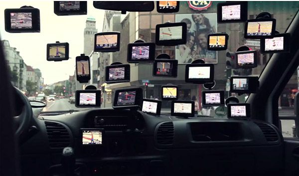 View from inside a car with twenty GPS devices suction-cupped to the windscreen. View from inside a car with twenty GPS devices suction-cupped to the windscreen.