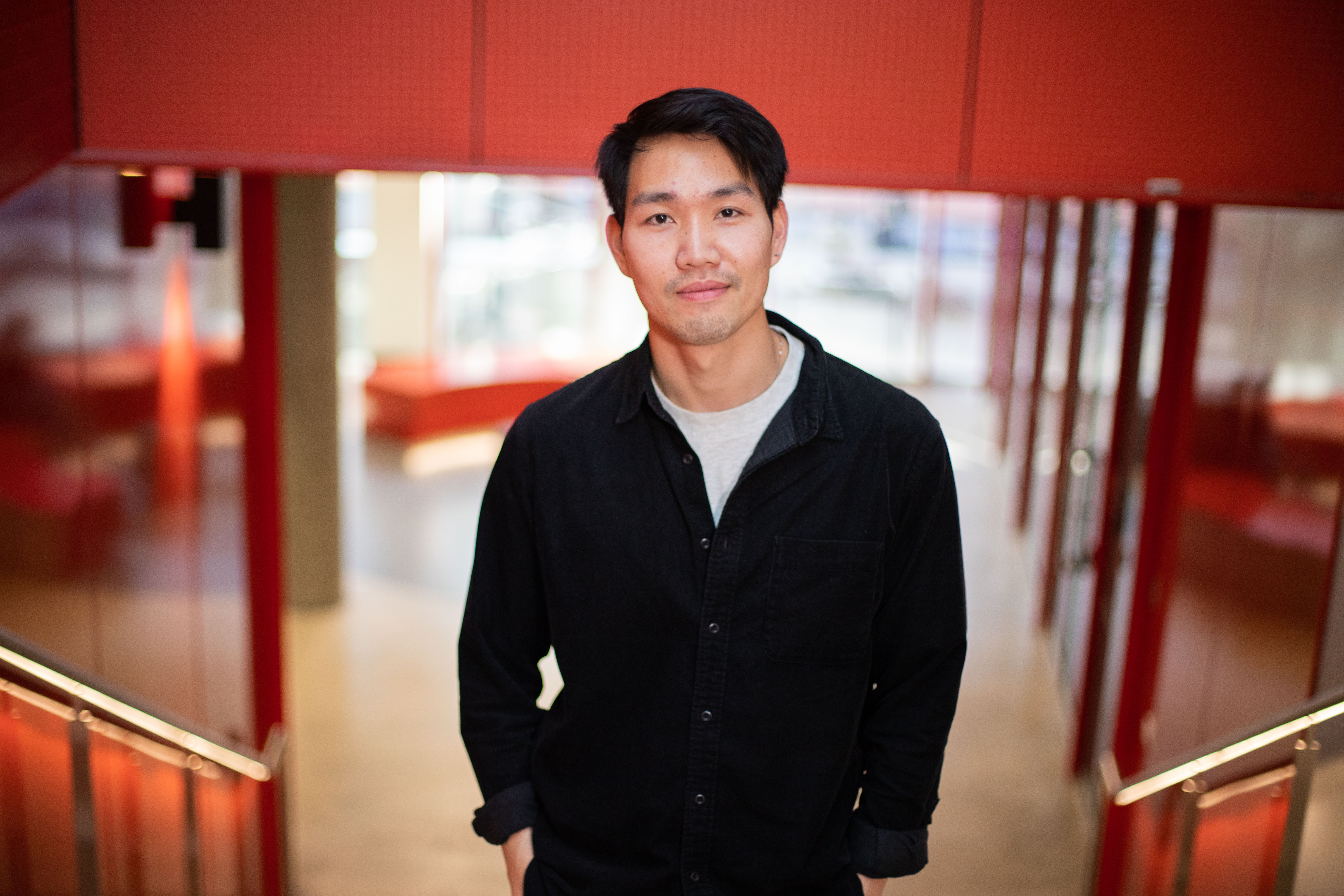 International student Aruk faces the camera, smiling.