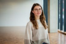 A student named Theresa facing the camera and smiling.