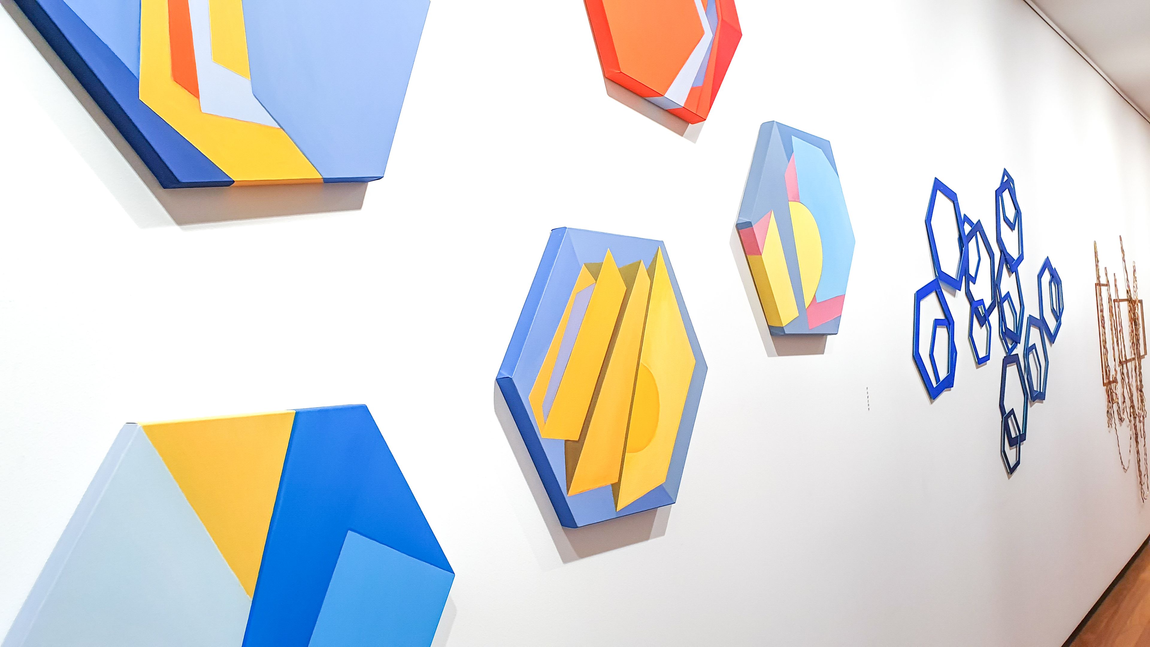 At This Point artwork A series of brightly coloured geometric artworks hang on a white wall in the Boroondara Town Hall Gallery