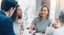 Group of business persons in discussion