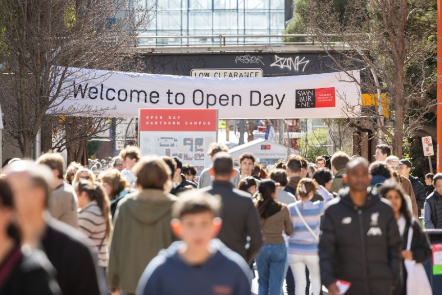 Open day banner with people walking around
