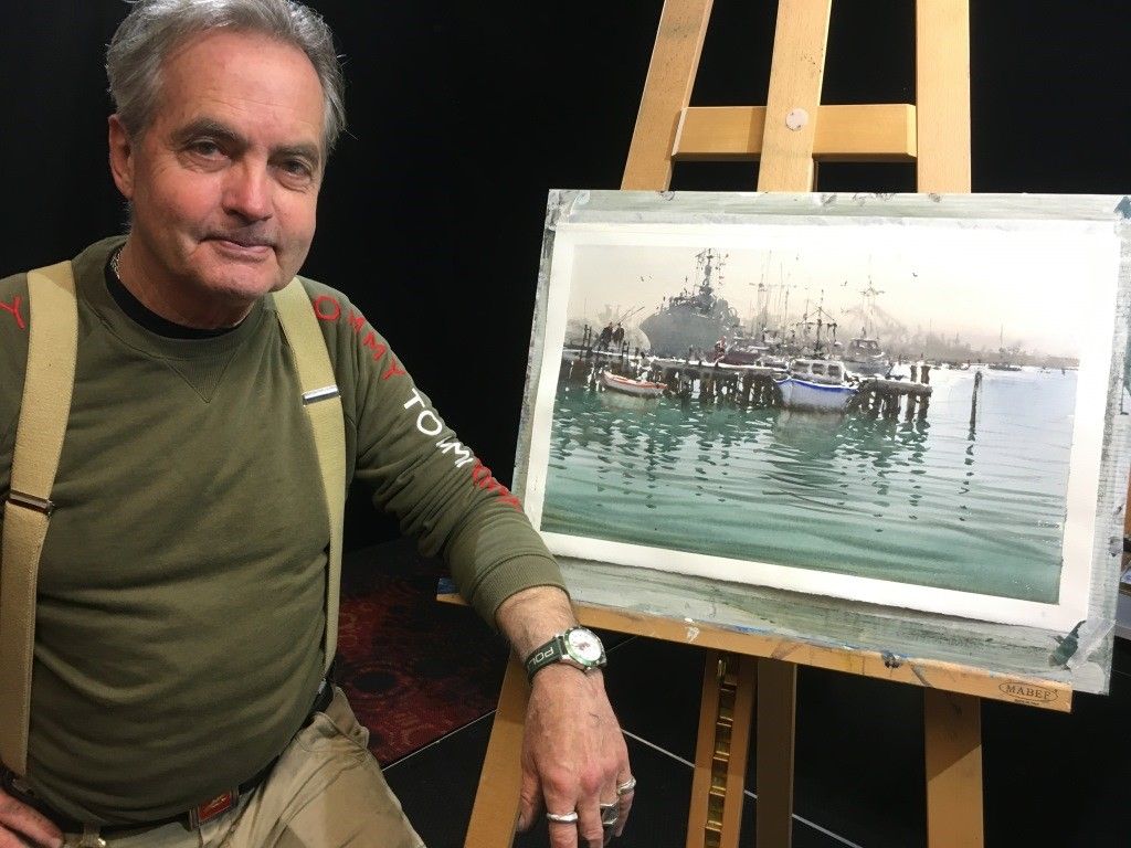 Joseph Zbukvic art show 2023 Joseph Zbukvic showing his painting of boat on the sea