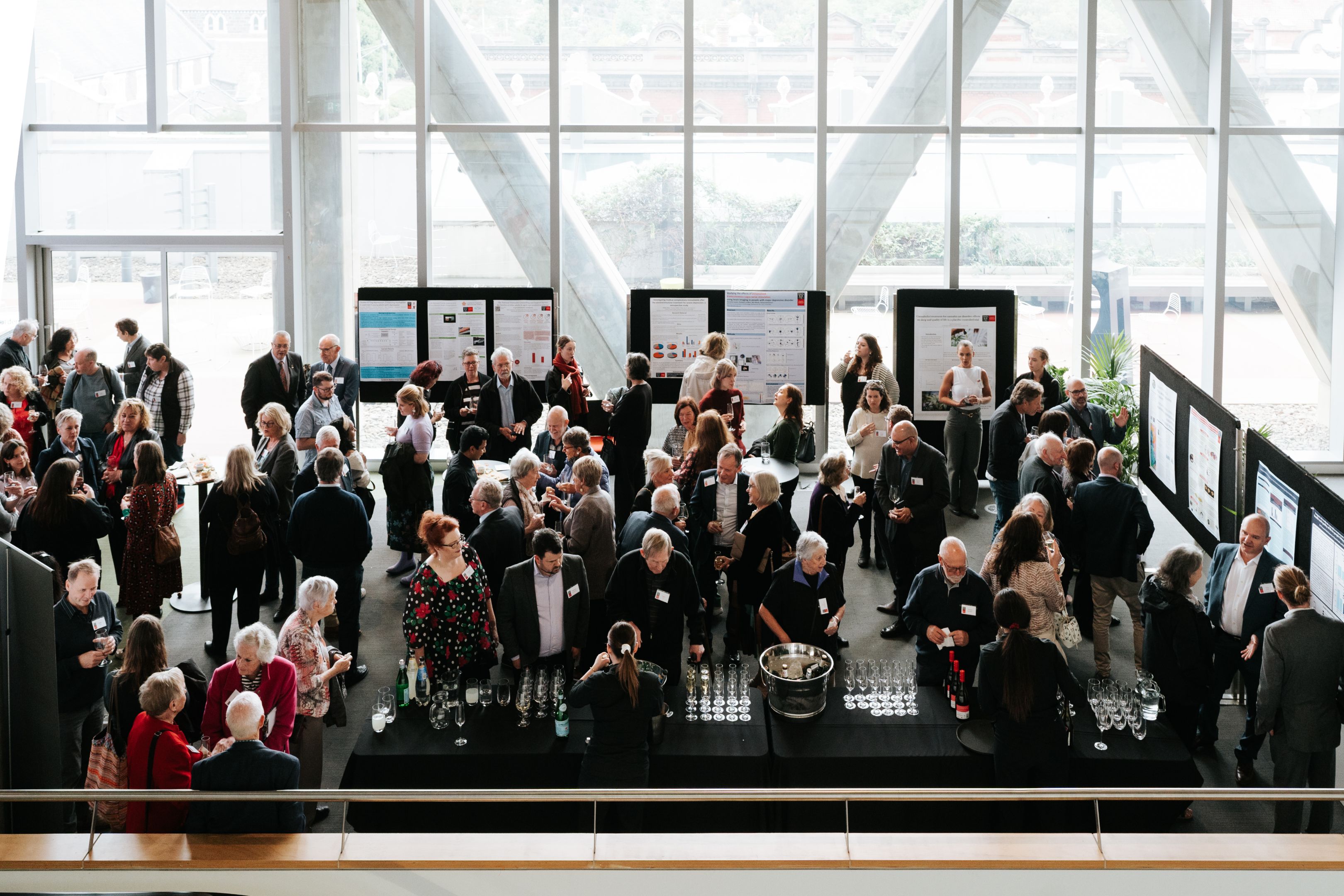 Barbara Dicker Brain Sciences Foundation Image of a Barbara Dicker Brain Sciences Foundation event with attendees discussing mental health research