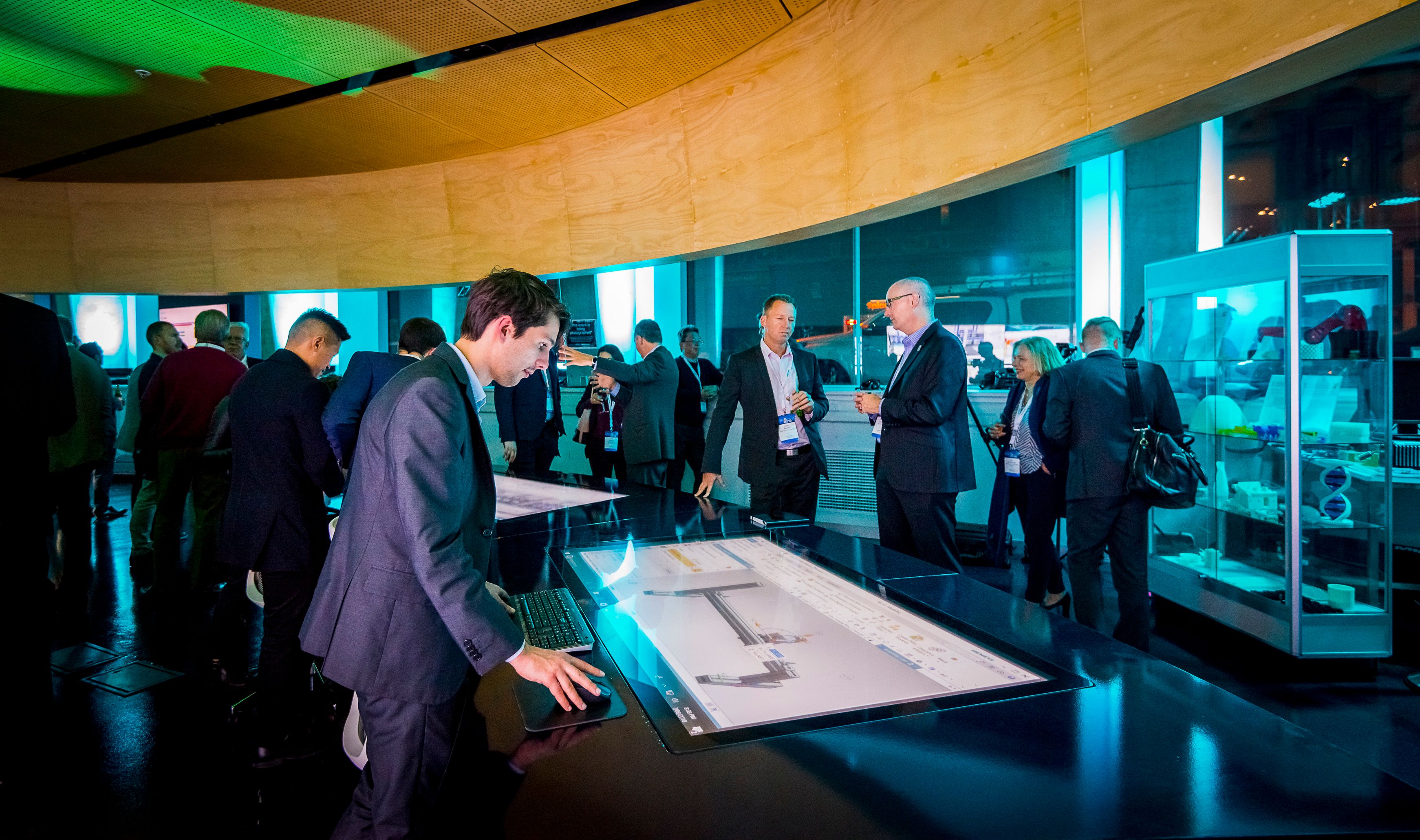 callan-halton-at-mindsphere-launch Swinburne graduate Callan Halton, operating a touch screen showing a Siemens factory simulation at the MindSphere launch event