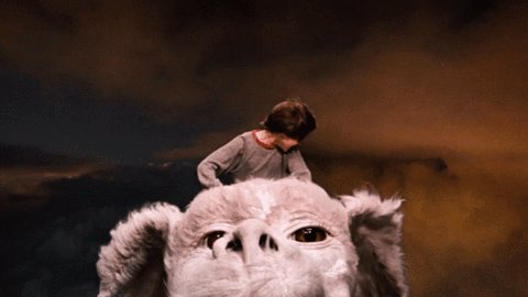 Bastian from The Neverending Story rides through the sky on Atreyu’s back Bastian from The Neverending Story rides through the sky on Atreyu’s back
