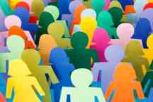A crowd of multicoloured paper cut-out figures of men and women.