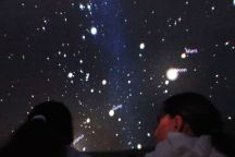 Two girls in a planetarium