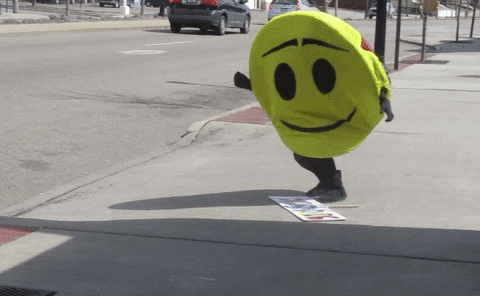 smiley-falls-over.gif A spruiker in a smiley face suit falls over trying to pick up their spruiking sign