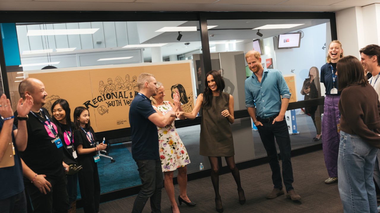 Prince Harry and Meghan speak with students and staff during a batyr-related visit on campus.