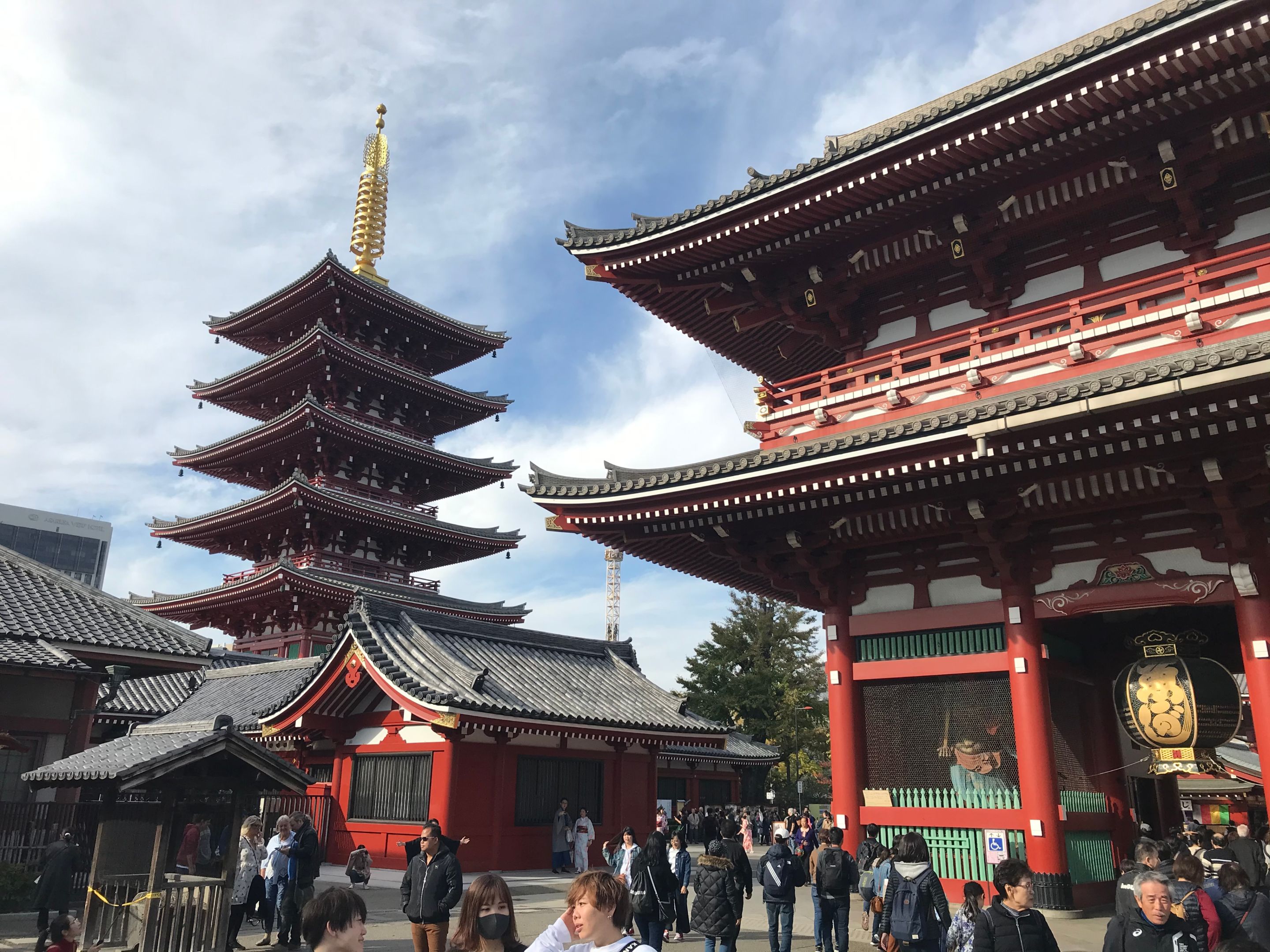 An image of tourists viewing Japanese red temples