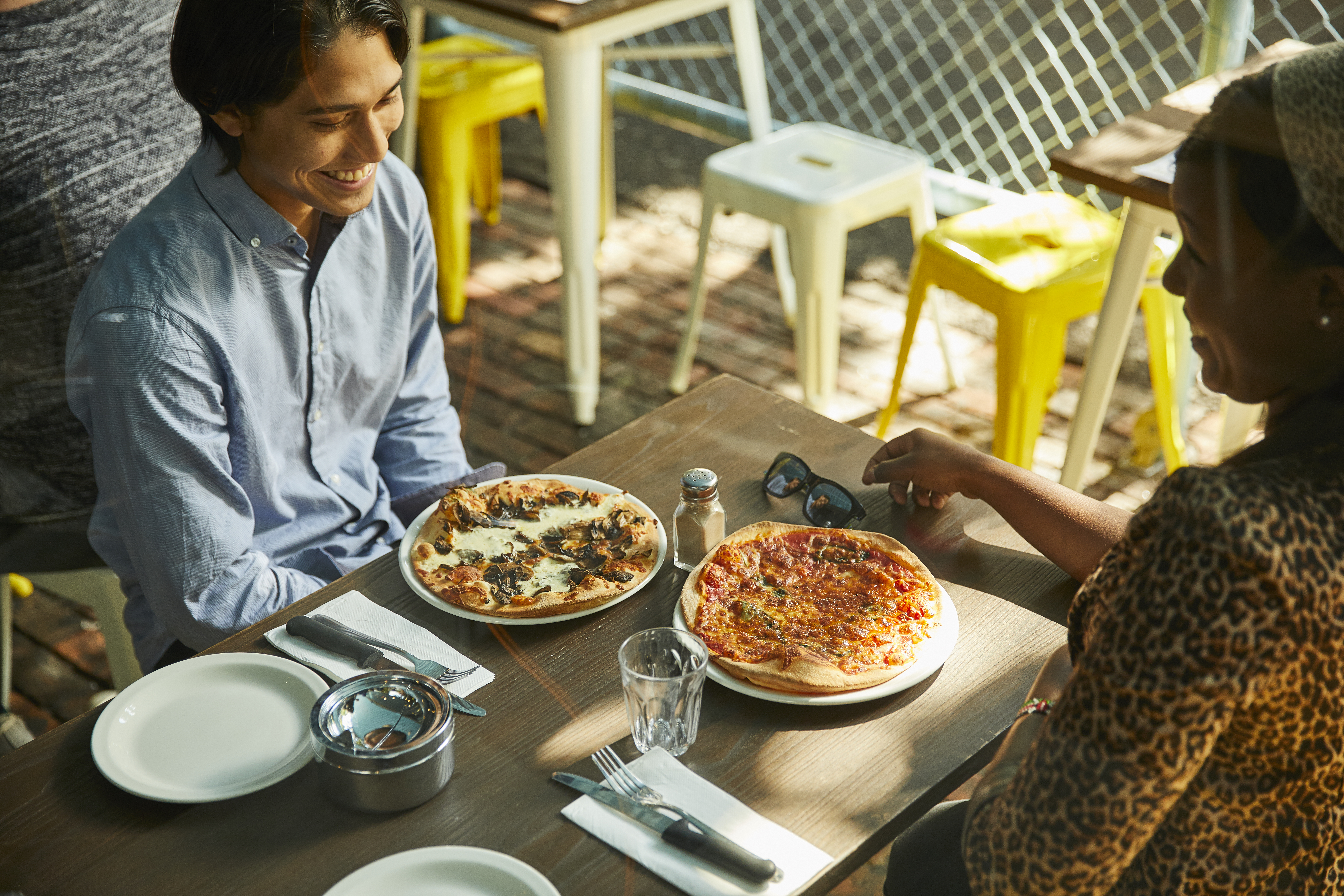 Holy Moly cafe, 2017 Two students eat pizza at an eatery in a Hawthorn laneway