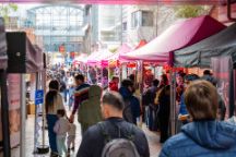 John street on Hawthorn campus during Orientation week showing club stalls and student crowd