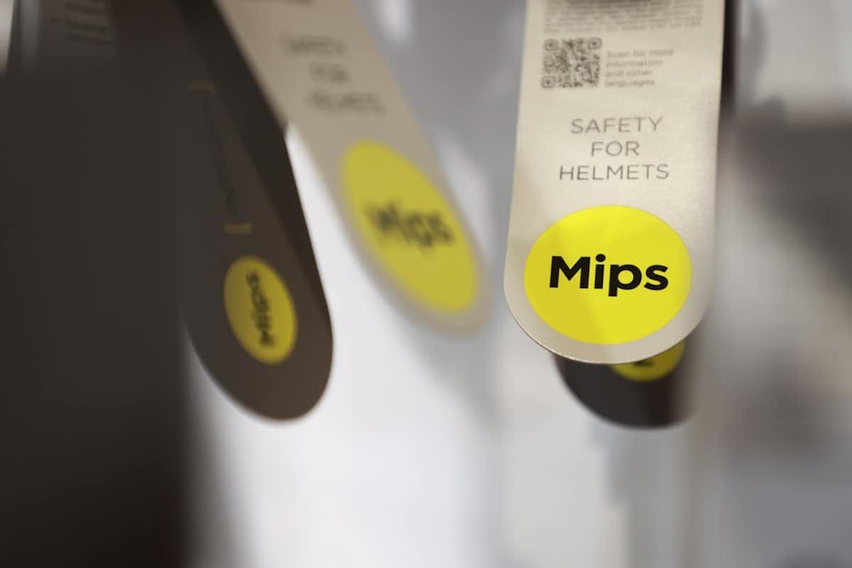MIPS bike helmet technology Helmet technology Mips tag hanging from a bike helmet in the store
