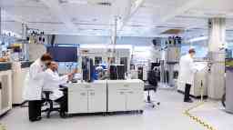 Medical Science professionals training students in a laboratory.