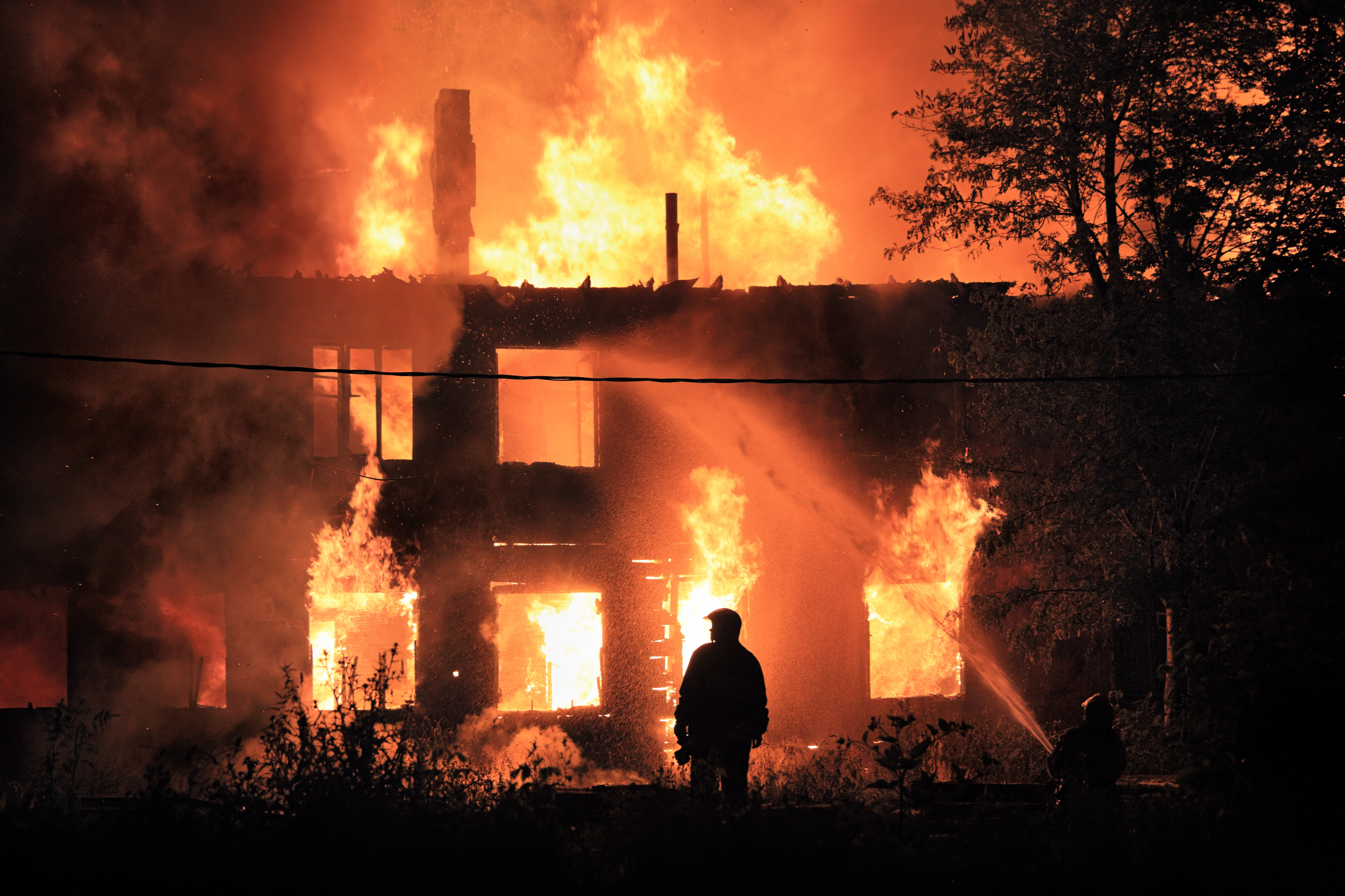 silhouette on housefire background