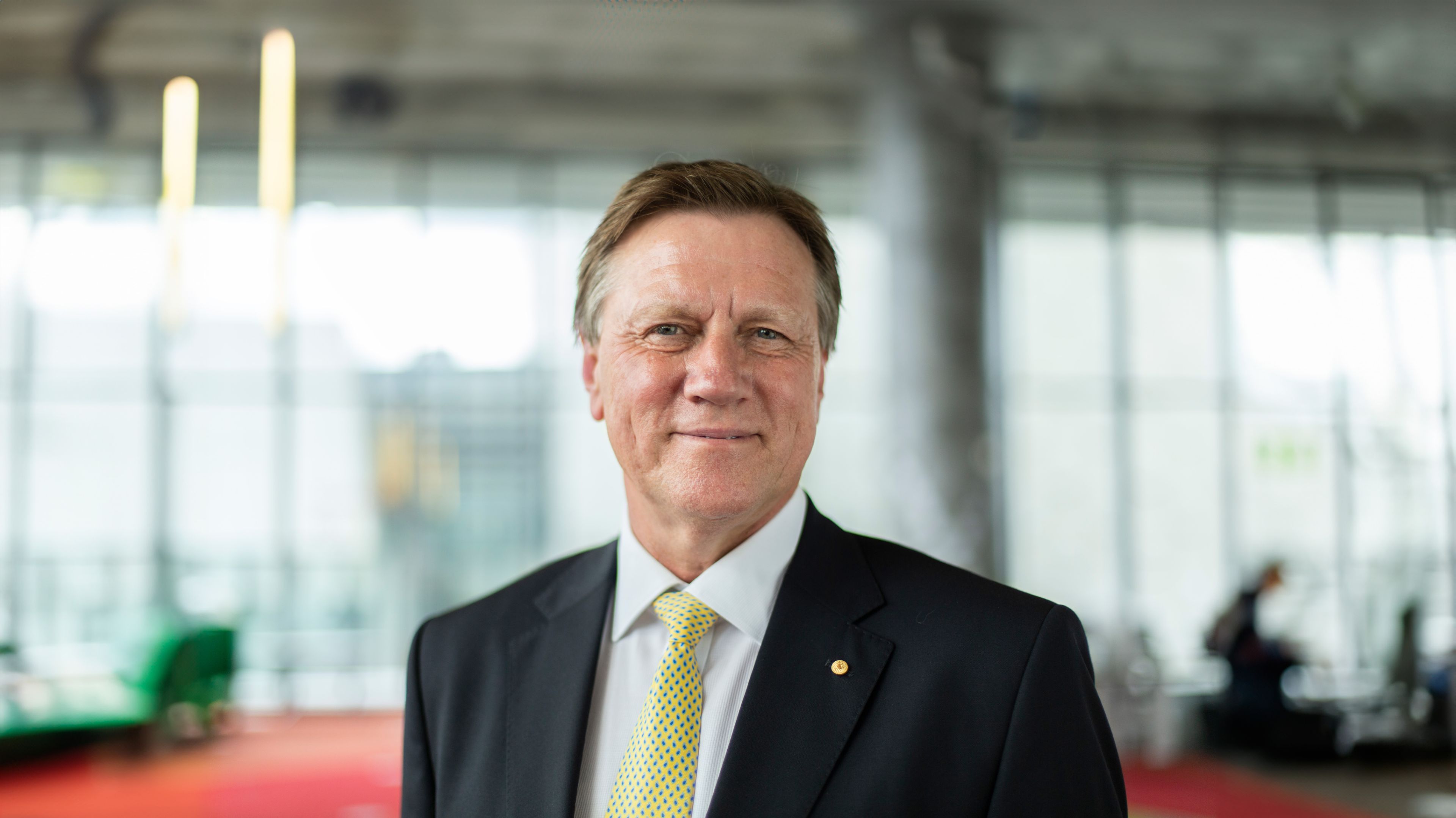 John Pollaers, Chancellor Swinburne University Chancellor, John Pollaers, smiles to camera in The George building of the Hawthorn campus