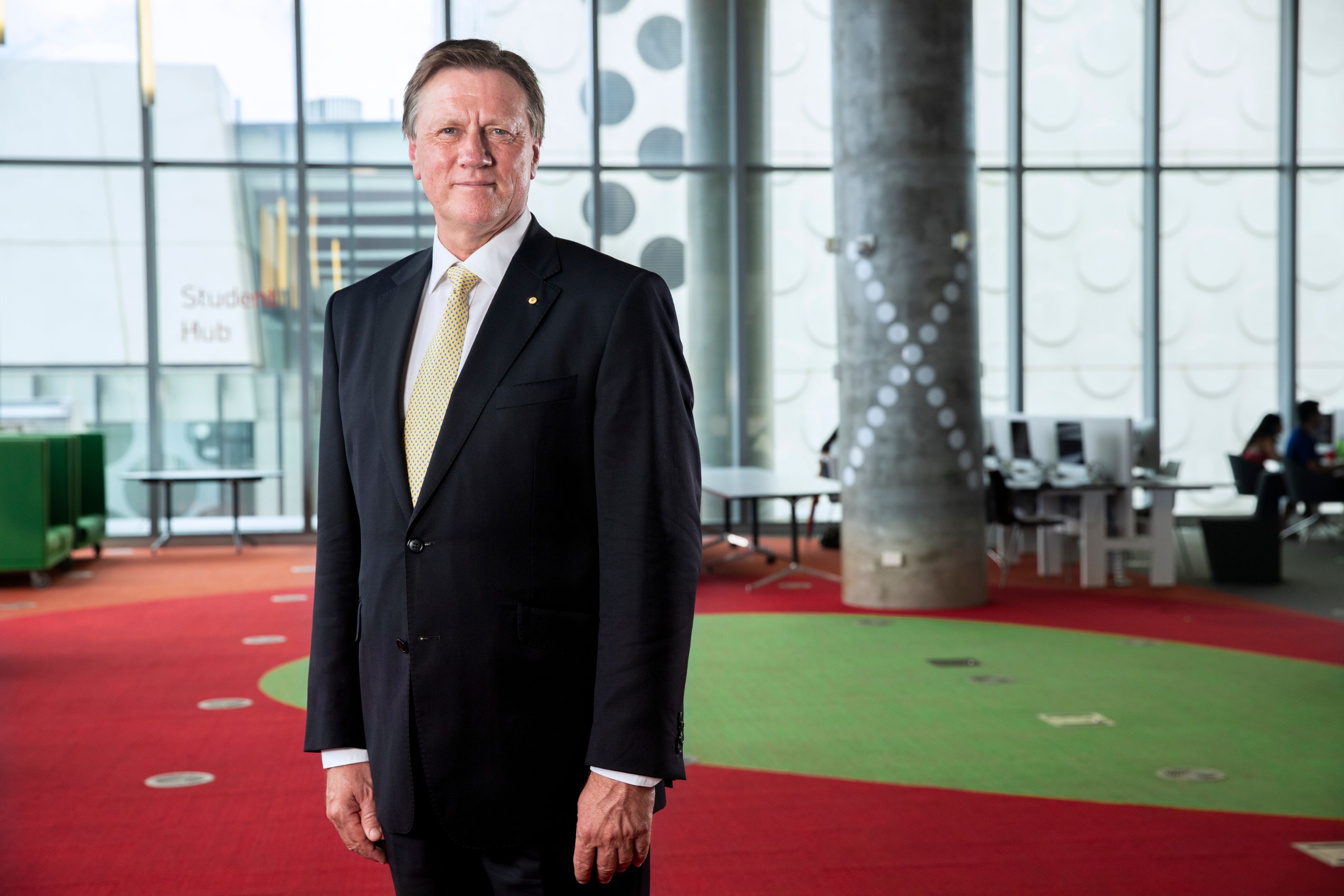 John Pollaers, Chancellor Chancellor of Swinburne stands wearing a suit looking to camera