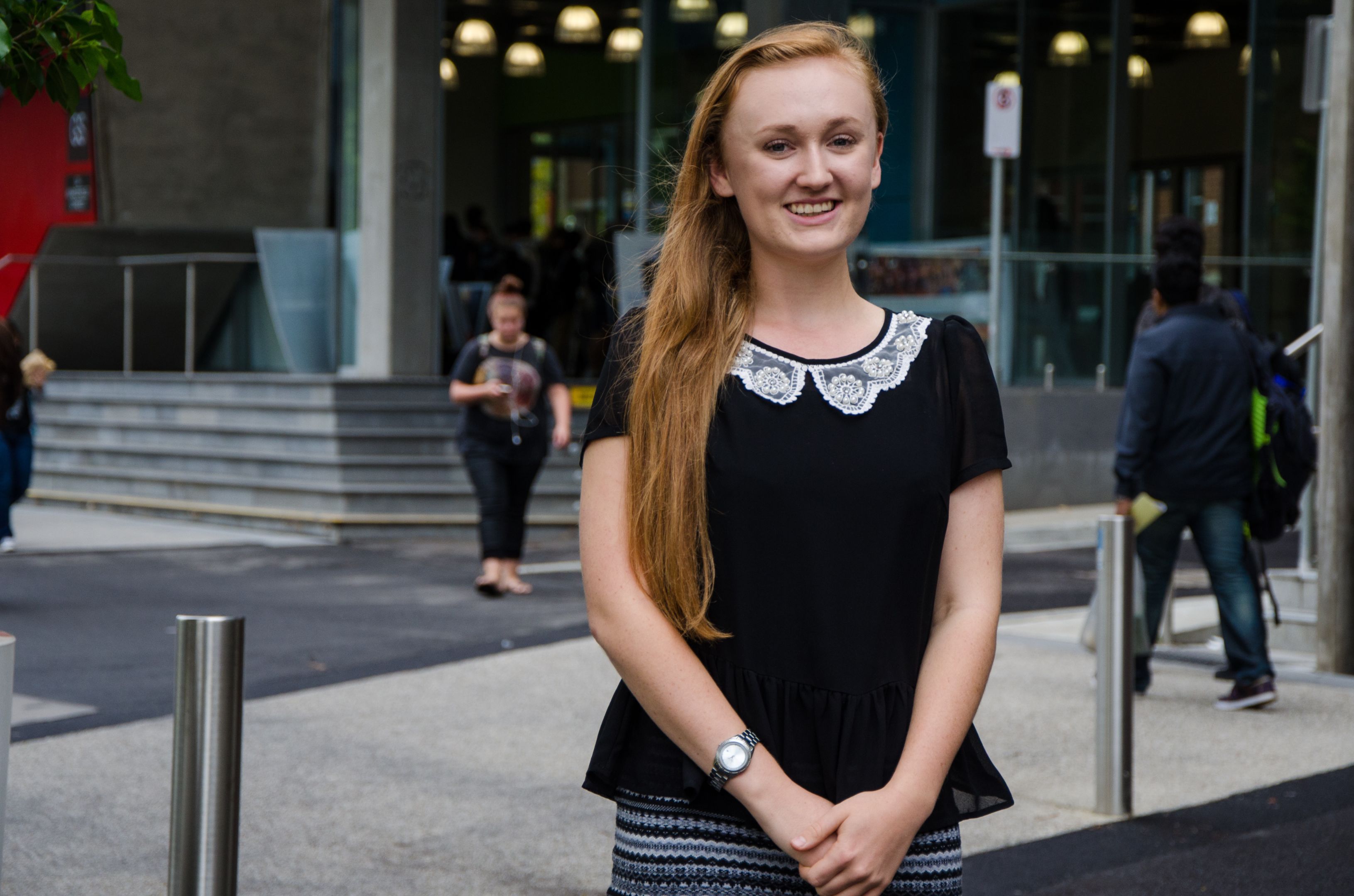 Grace Lawrence, student Female student smiling to camera on Swinburne campus
