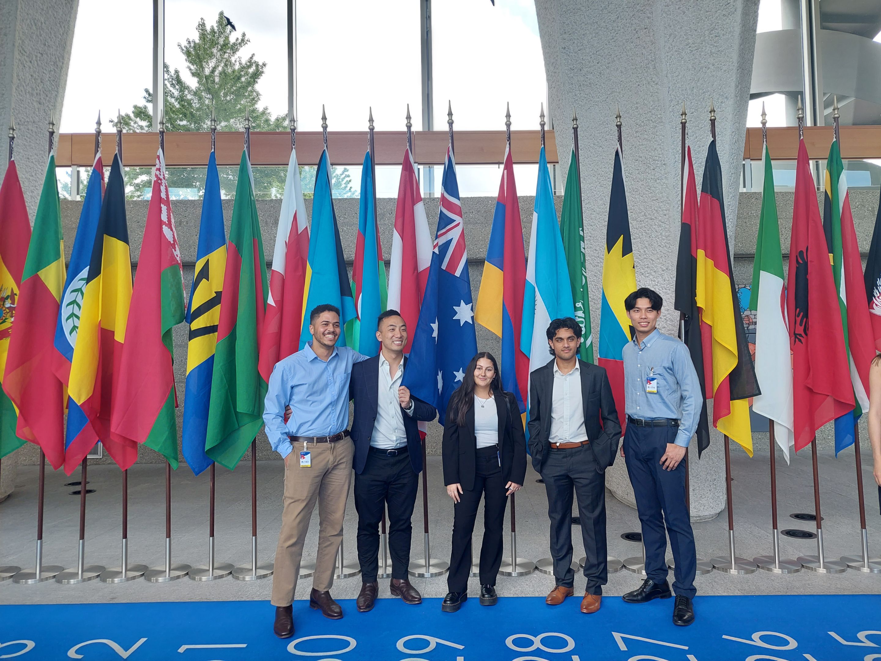 HEG Fribourg Summer School 2024 in Switzerland HEG Fribourg Summer School 2024 in Switzerland. Image of students standing in front of international flags.