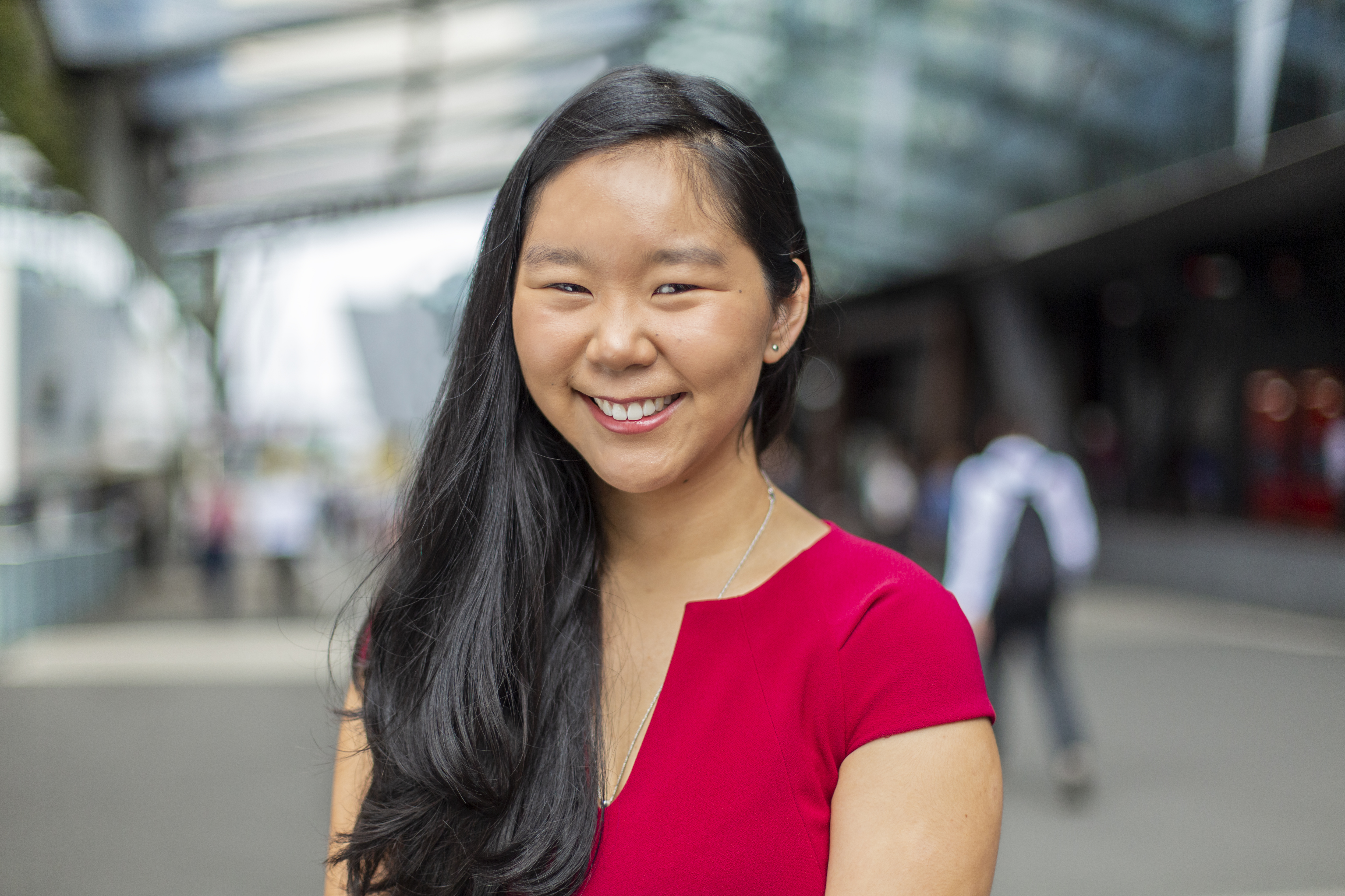 Jessica, a Swinburne student Young female international student, wearing red, smiling at the camera