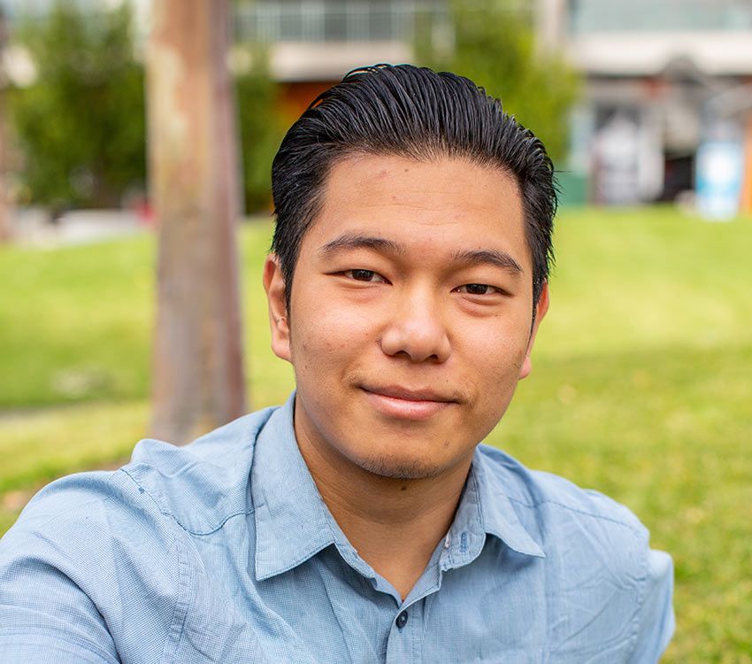 Noah Htin Lin Htet Closeup of Noah Htin Lin Htet smiling to camera with the Swinburne quad blurred in the background