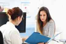 Adult woman having a visit at female doctor's office.