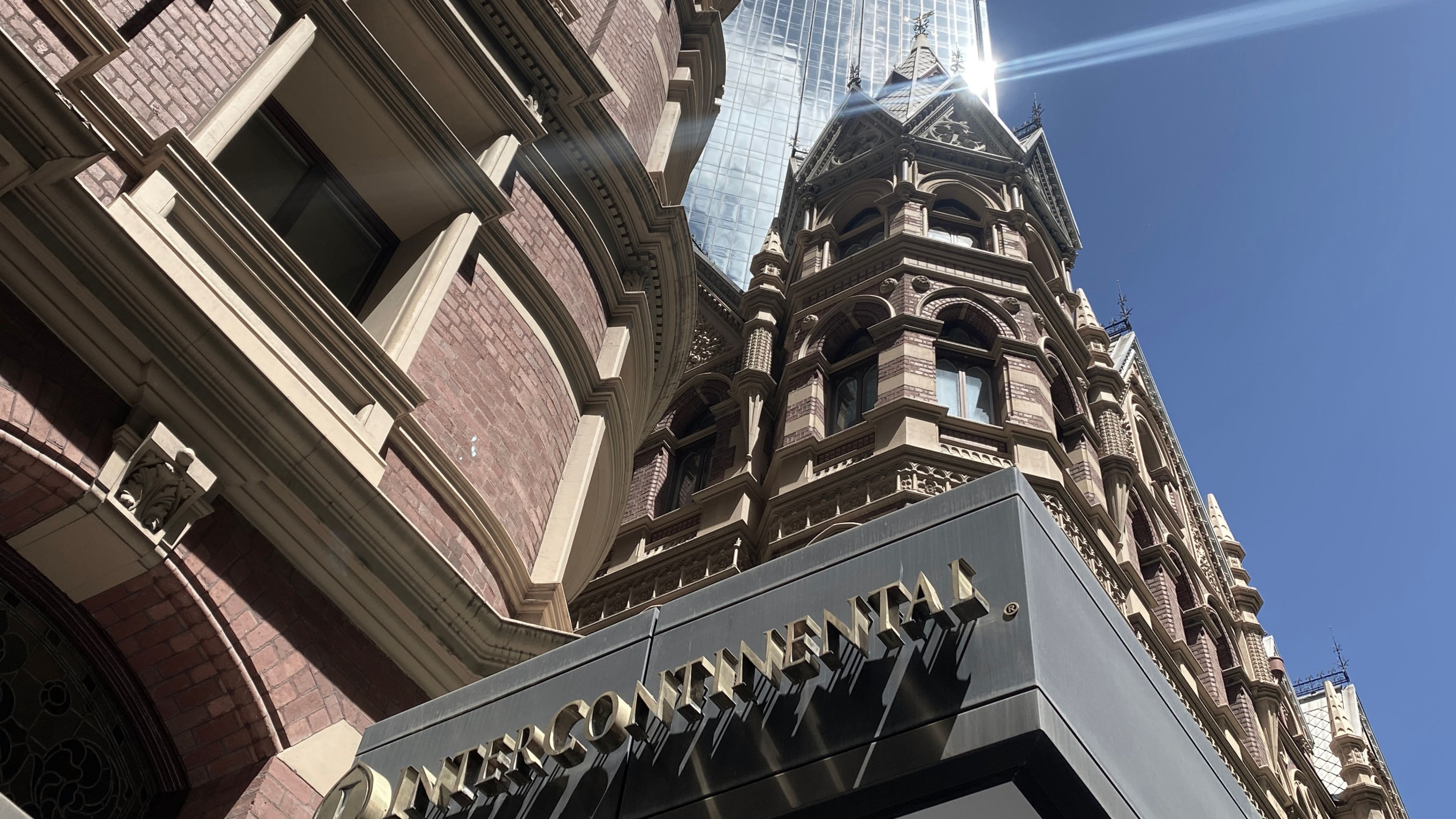 Intercontinental Hotel, Melbourne Looking up at the Intercontinental Hotel red brick building with a skyscraper in the background.
