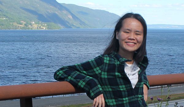 Phui Jing Ling Photograph of Swinburne alumna Phui Jing Ling standing outdoors near a body of water.