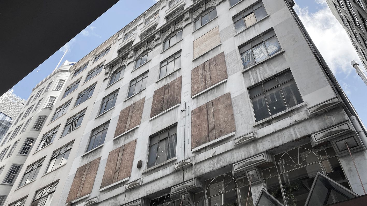 Walk Arcade Looking up at a derelict building with boarded up windows in the Walk Arcade, Melbourne.