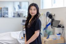 Female nursing student standing in hospital environment